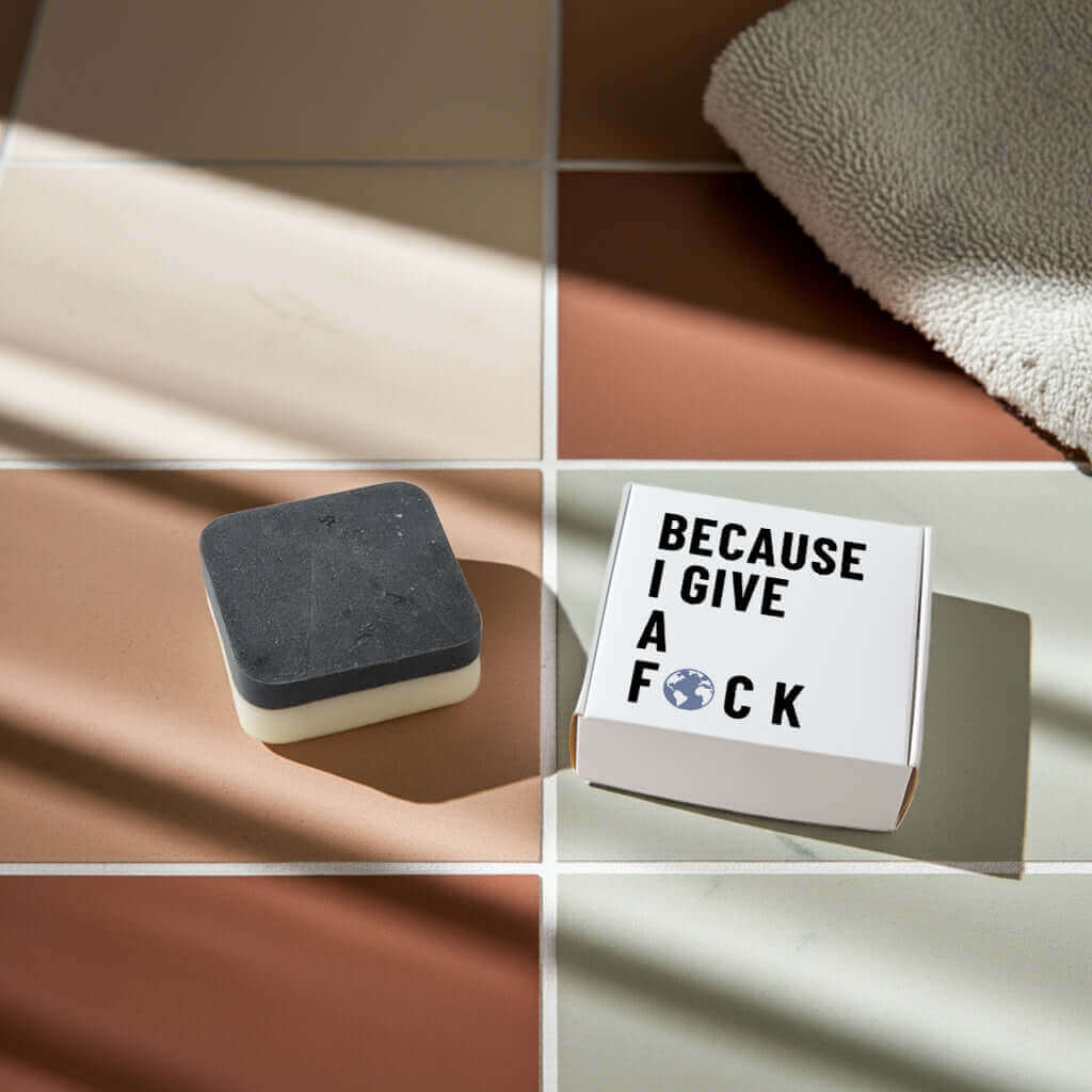 Eco-friendly coffee soap in real use on sink counter — exfoliating and cleansing bar in action