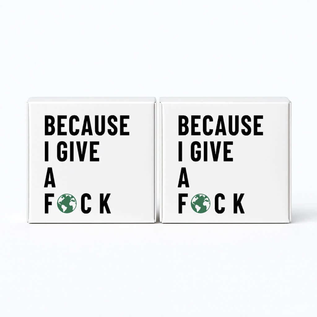 Two signs with text 'BECAUSE I GIVE A F*CK' on a white background