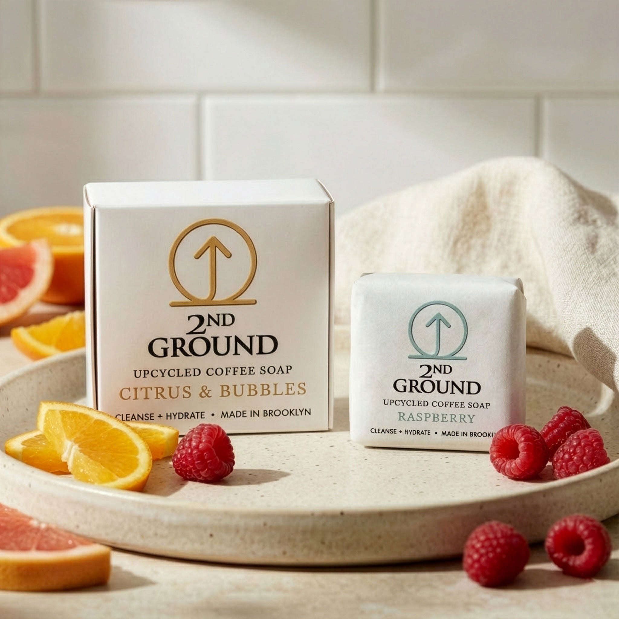 Citrus BOGO Set (Buy Full Size, Get Raspberry Guest Bar Free) with upcycled coffee soap bars on a plate.